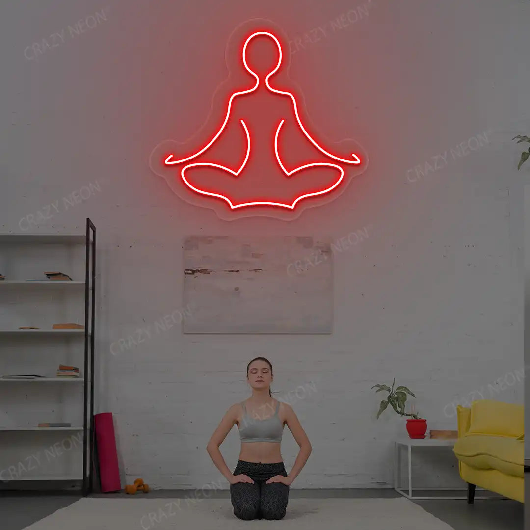 Sukhasana Yoga Neon Sign lighting up in red color in a yoga room