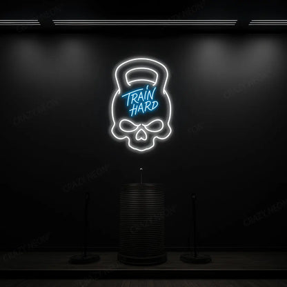 ice blue and white train hard kettlebell neon sign mounted on a wall