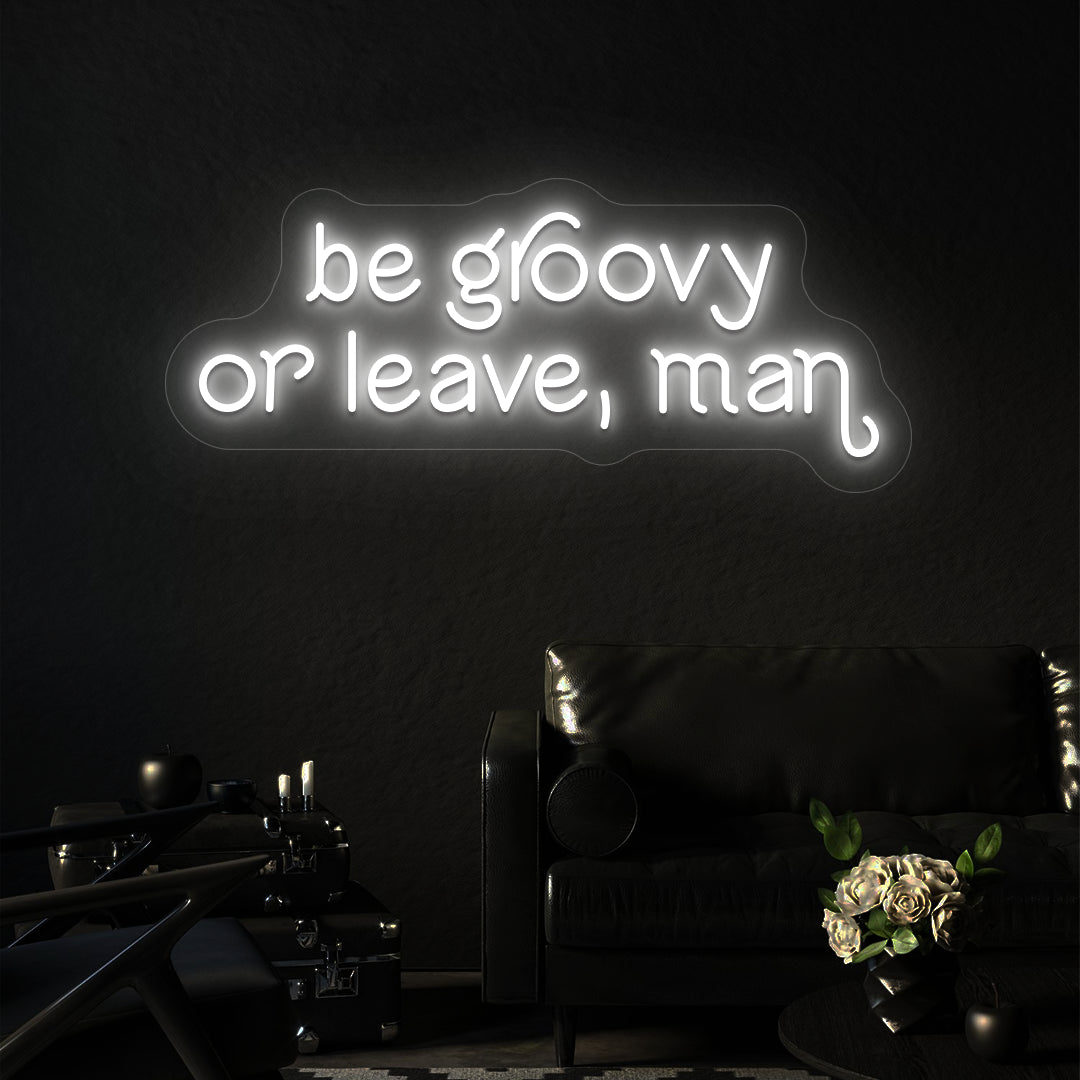 white be groovy or leave, man vintage neon sign mounted on a wall