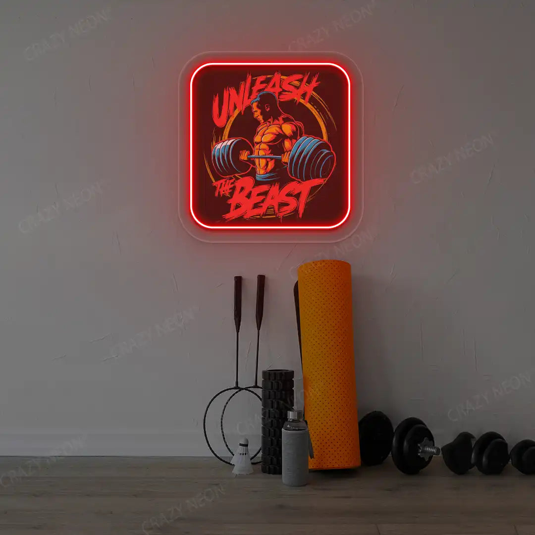 red unleash the beast gym neon artwork mounted on a wall