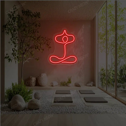 Sukhasana With Arms Raised Contour Yoga Neon Sign glowing in red color in a yoga room
