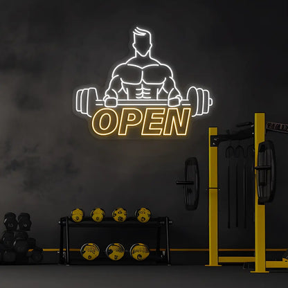 orange and white open gym bodybuilder neon sign mounted on a wall