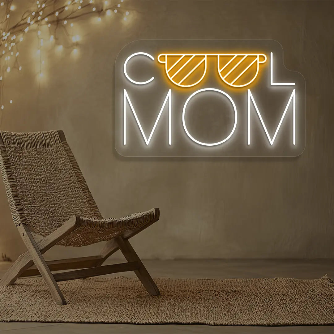 orange and white cool mom trendsetter neon sign mounted on a wall