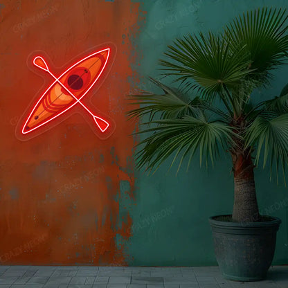 red kayak boat neon artwork mounted on a wall