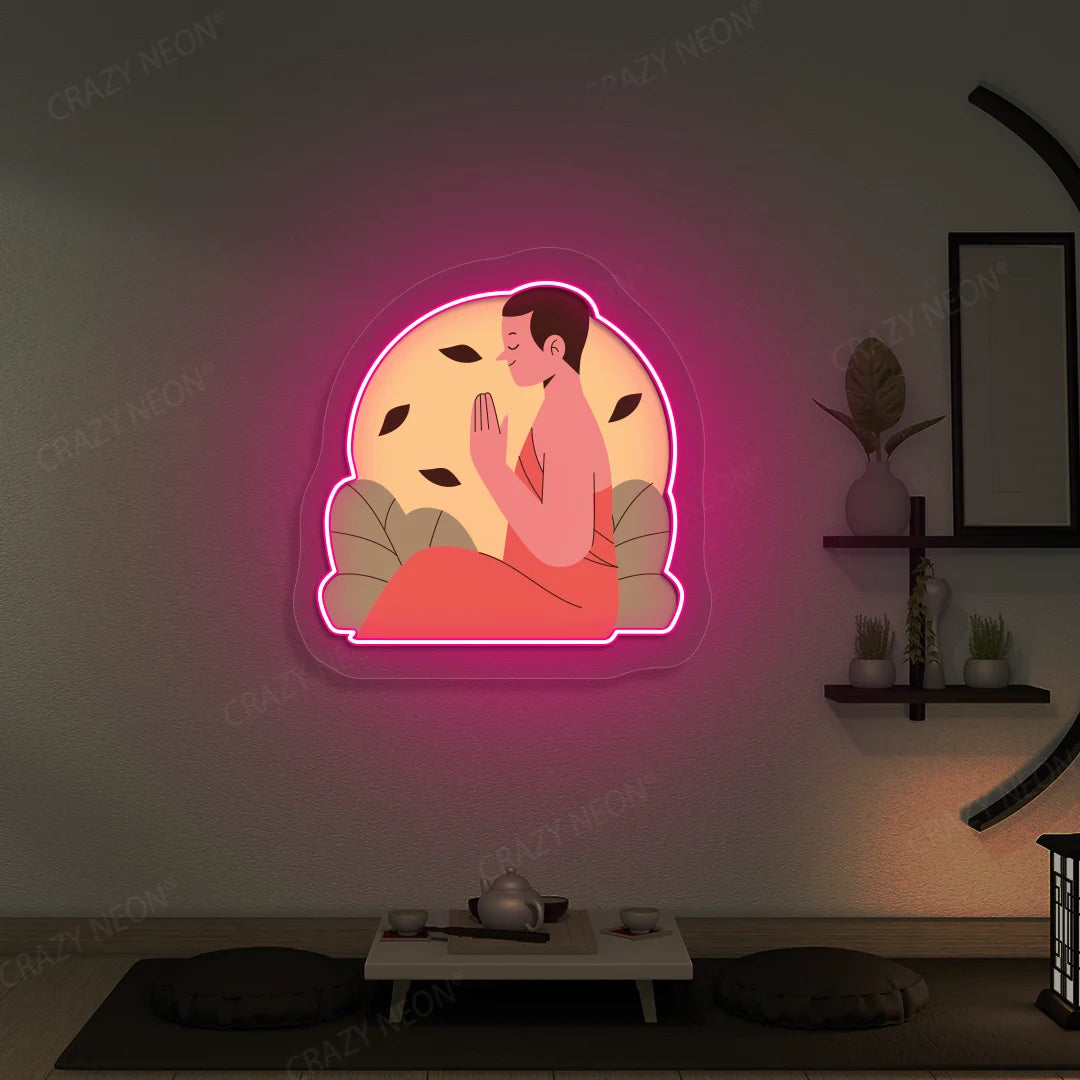 Serene Monk Neon Artwork lighting up in pink color in a yoga room