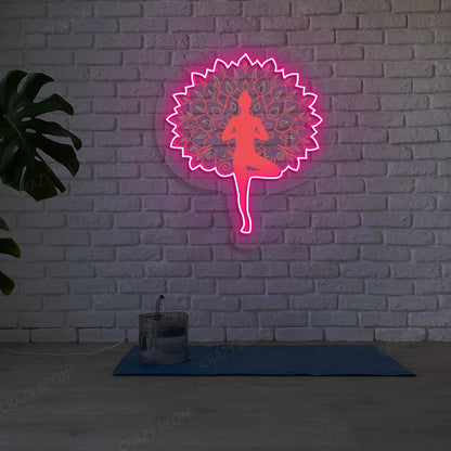 Mandala Yogi Harmony Tree Pose Yoga Neon Artwork lighting up in pink color in a yoga room