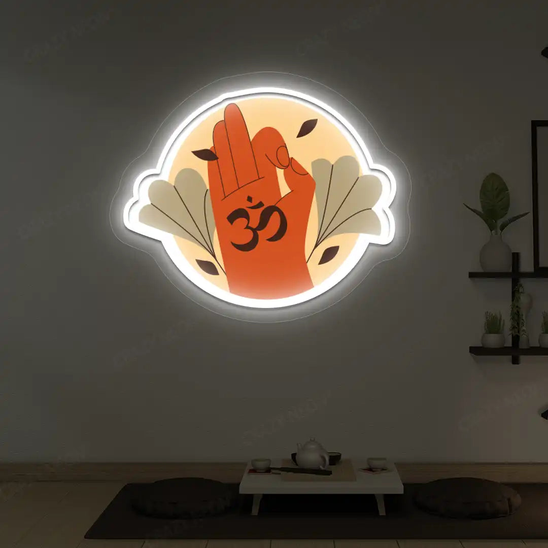 Om Gyan Mudra Neon Artwork lighting up in white color in a yoga room