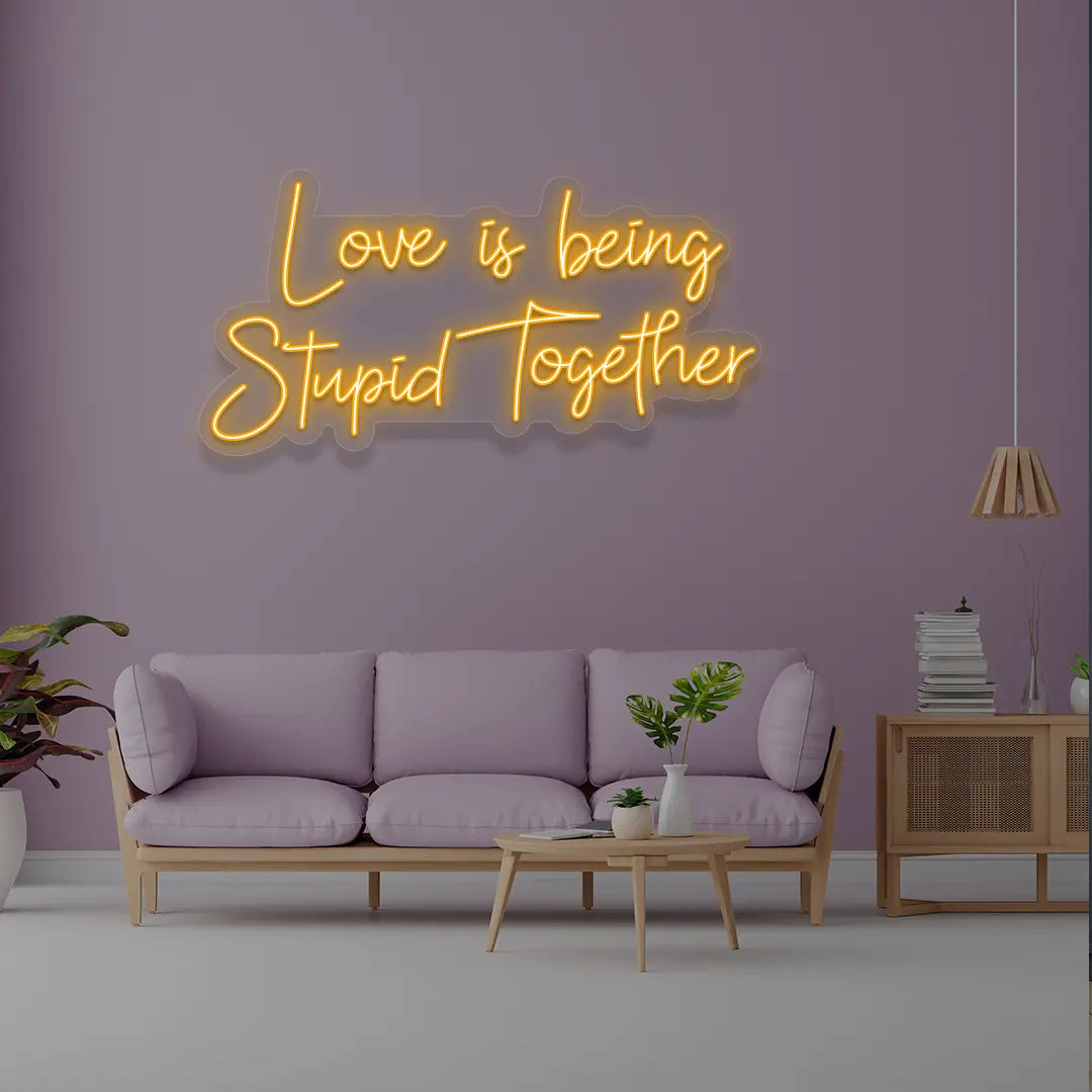 Love Is Being Stupid Together Neon Sign in Orange Color 