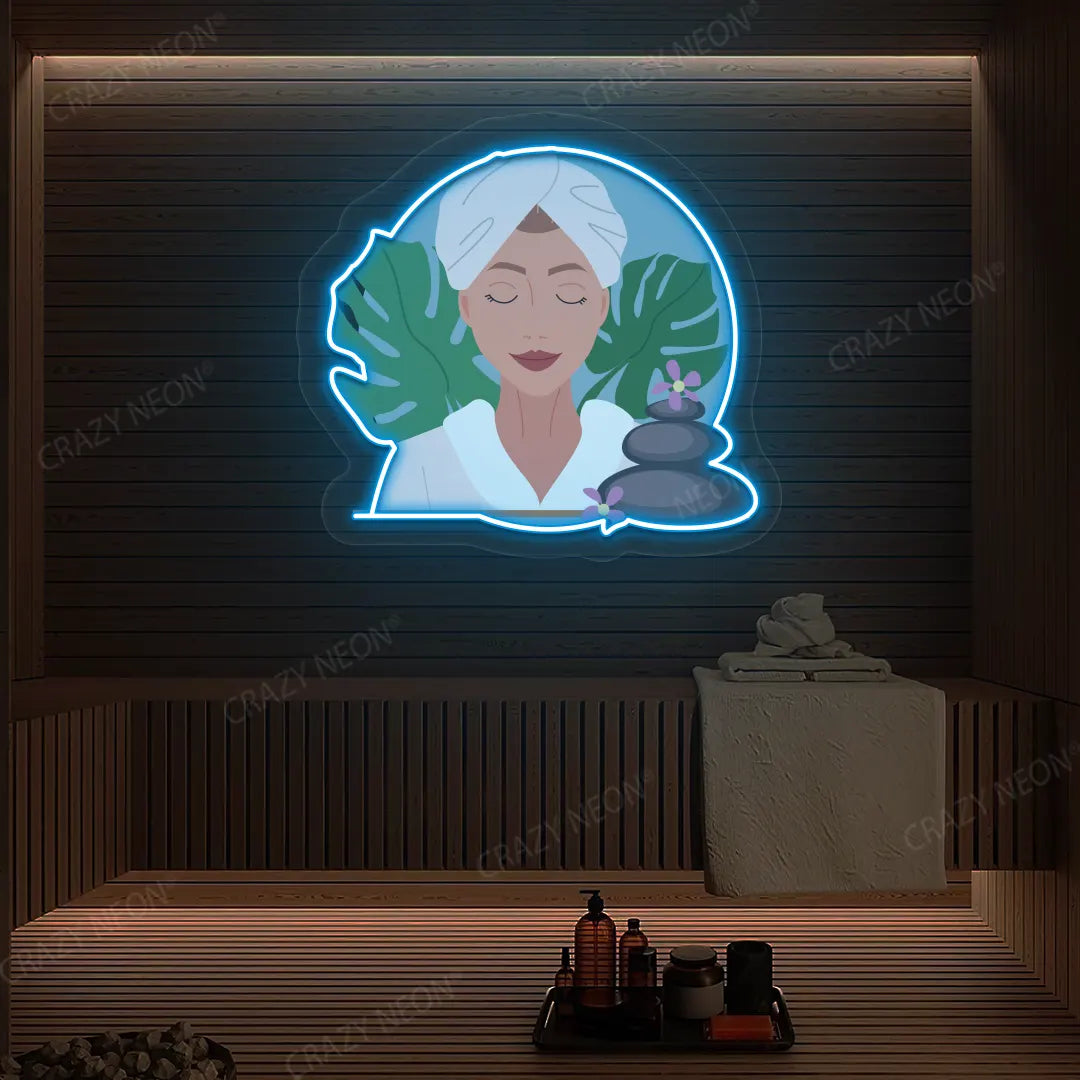 Zen Facial Spa Neon Artwork lighting up in ice blue color on a wooden spa wall