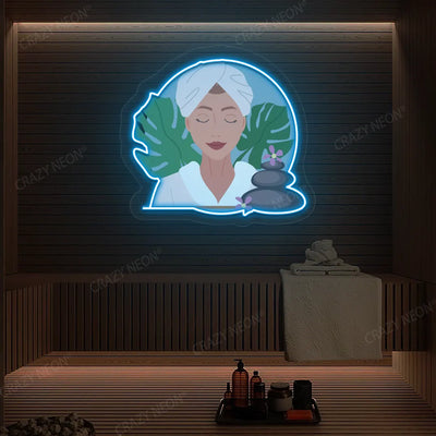 Zen Facial Spa Neon Artwork lighting up in ice blue color on a wooden spa wall