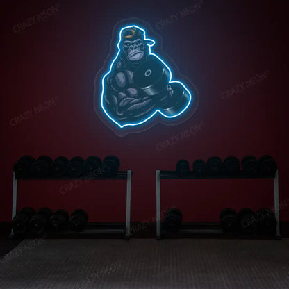 ice blue gorilla dumbbell lifting gym neon artwork mounted on a wall