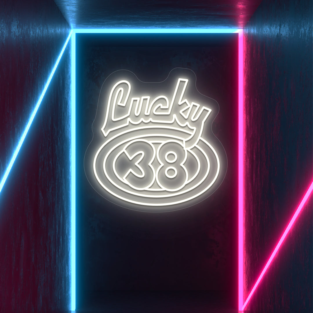warm white the lucky 38 vintage neon sign mounted on a wall
