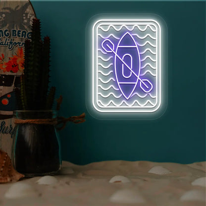 purple and white kayak ocean waves neon sign mounted on a wall