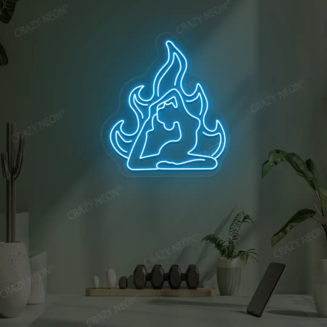 Flamed Eka Pada Rajakapotasana Yoga Neon Sign lighting up in ice blue color in a yoga room