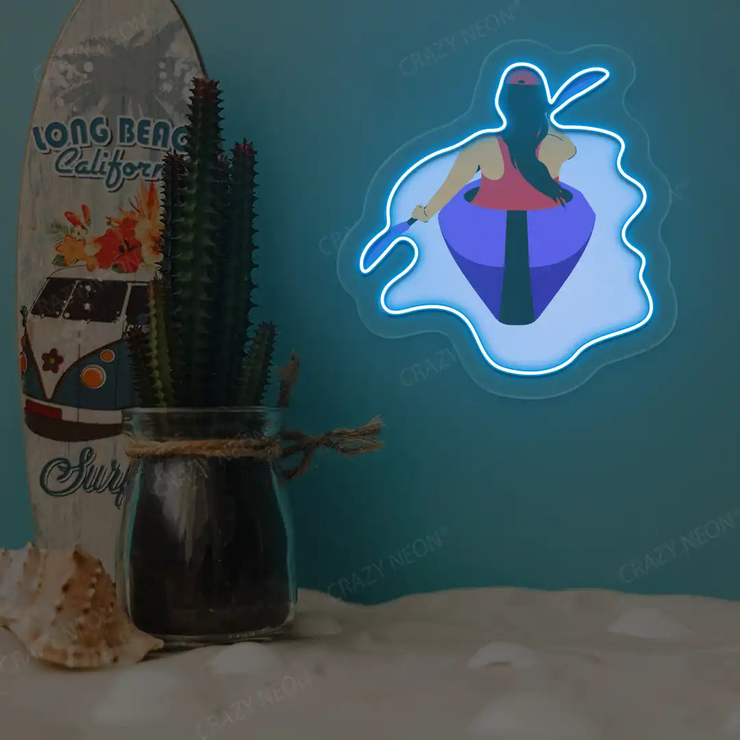 ice blue woman kayaking neon artwork mounted on a wall