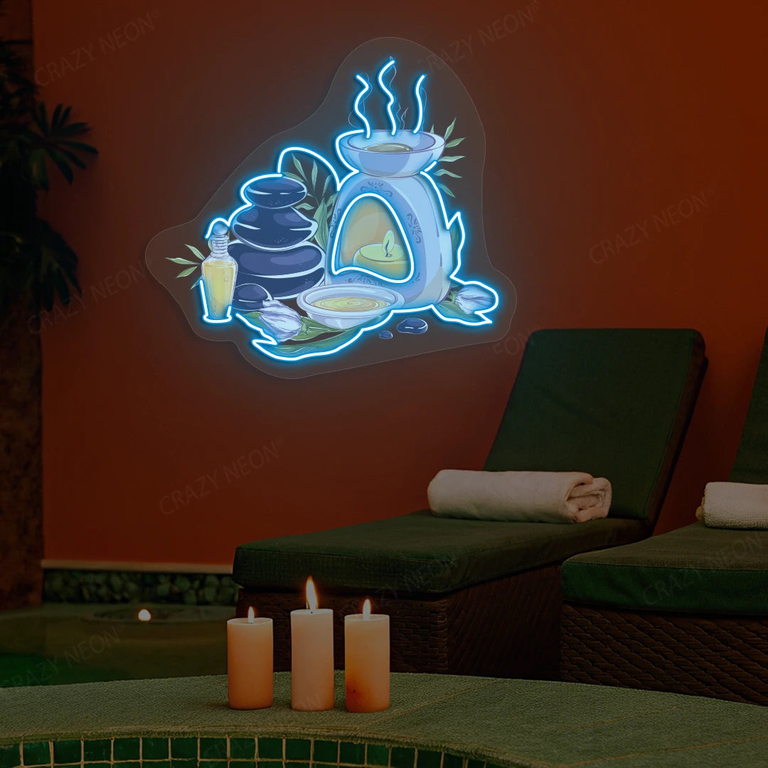 Spa Stones & Aromatherapy Neon Artwork lighting up in ice blue color on a spa wall