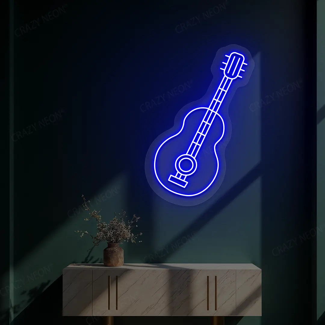 blue acoustic guitar neon sign mounted on a wall