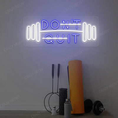 blue and white don’t quit do it neon sign mounted on a wall