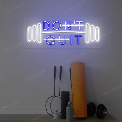 blue and white don’t quit do it neon sign mounted on a wall