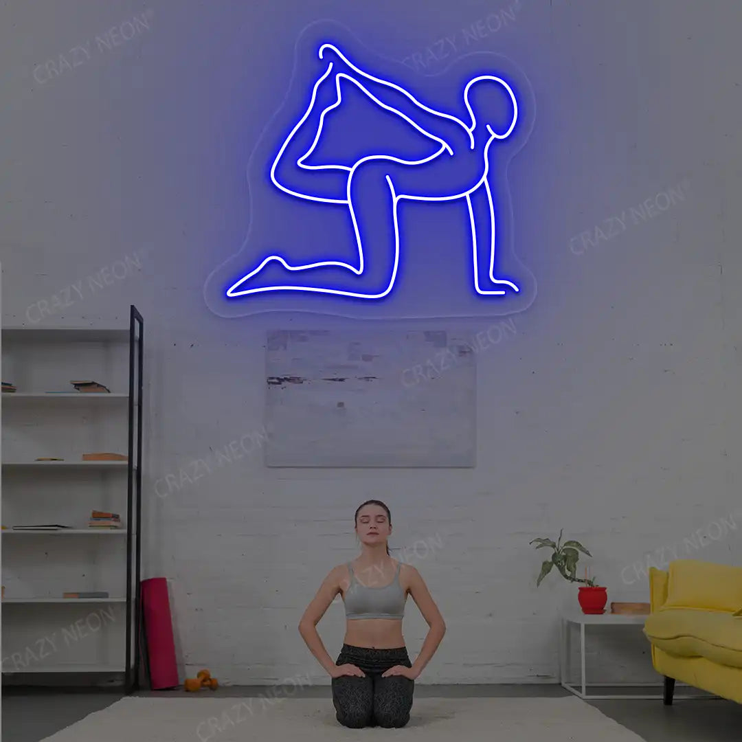Eka Hasta Vyaghrasana Yoga Neon Sign glowing in blue color in a yoga room