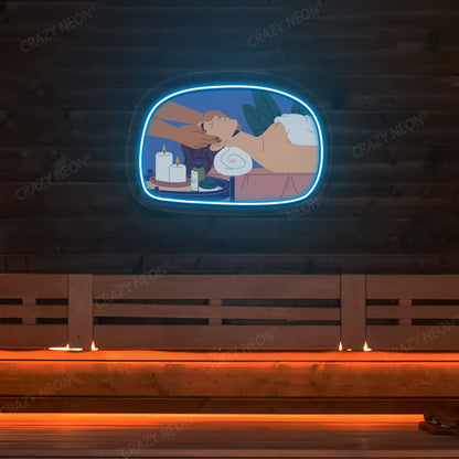 Relaxation Massage Neon Artwork lighting up in ice blue color on a wooden spa wall
