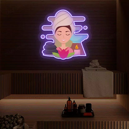 Steam Wellness Neon Artwork lighting up in purple color on a wooden spa wall