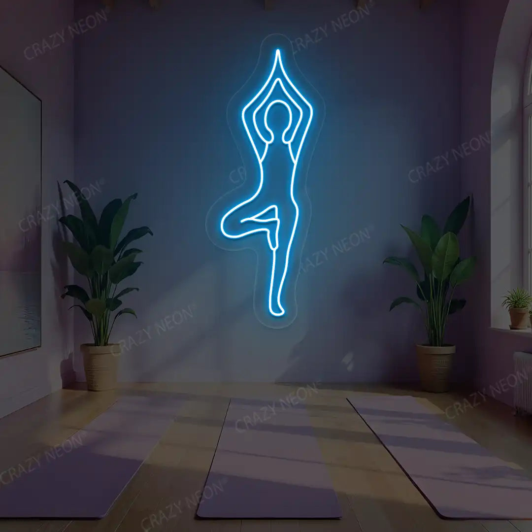 Vrikshasana Yoga Neon Sign lighting up in ice blue color in a yoga room