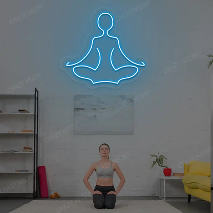 Sukhasana Yoga Neon Sign lighting up in iceblue color in a yoga room