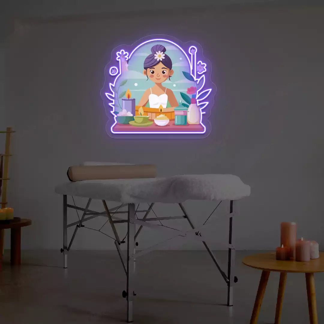 Spa Girl Neon Artwork lighting up in purple color on a spa wall
