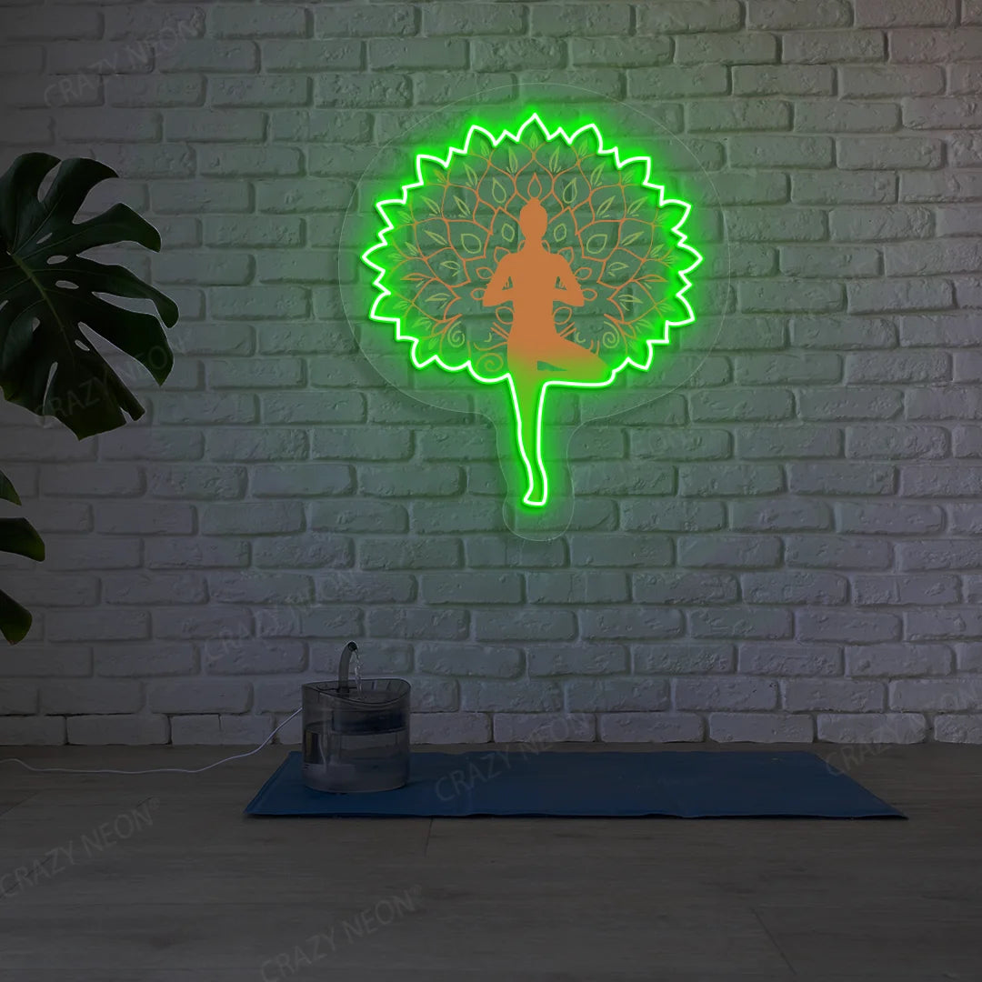 Mandala Yogi Harmony Tree Pose Yoga Neon Artwork lighting up in green color in a yoga room
