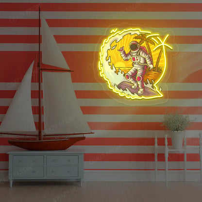 yellow astronaut surfing neon artwork mounted on a wall