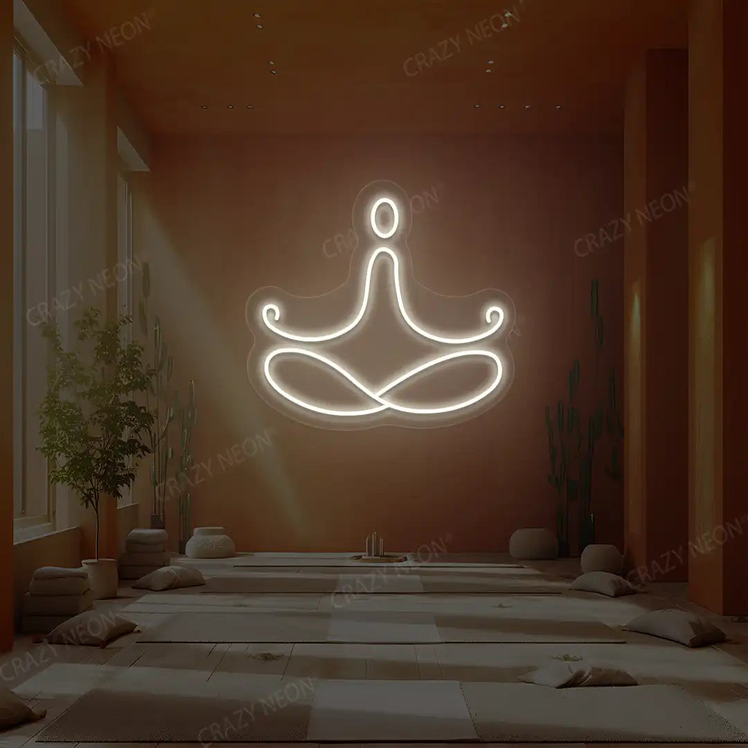 Padmasana Yoga Neon Sign lighting up in warm white color in a yoga room