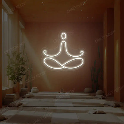 Padmasana Yoga Neon Sign lighting up in warm white color in a yoga room