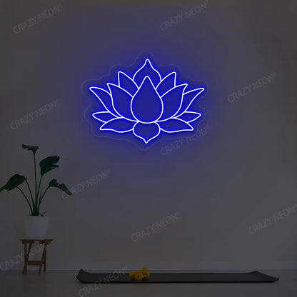 Lotus Flower Neon Sign lighting up in blue color in a yoga room