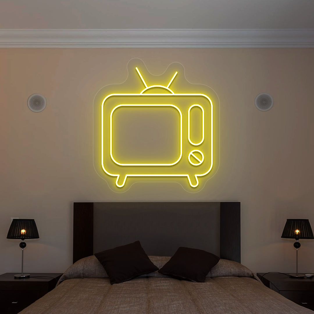 yellow retro tv vintage neon sign mounted on a wall