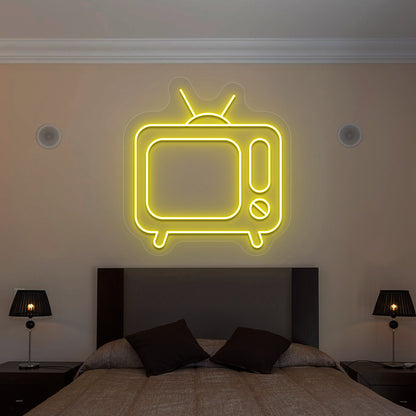 yellow retro tv vintage neon sign mounted on a wall