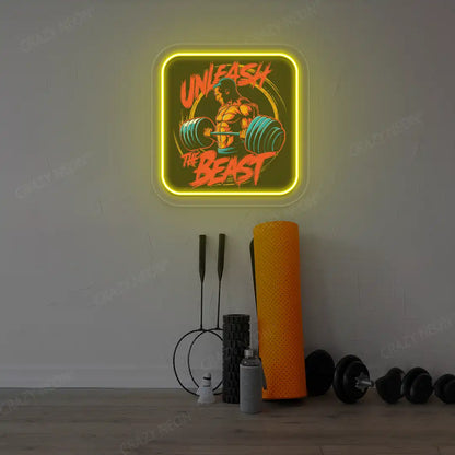 yellow unleash the beast gym neon artwork mounted on a wall