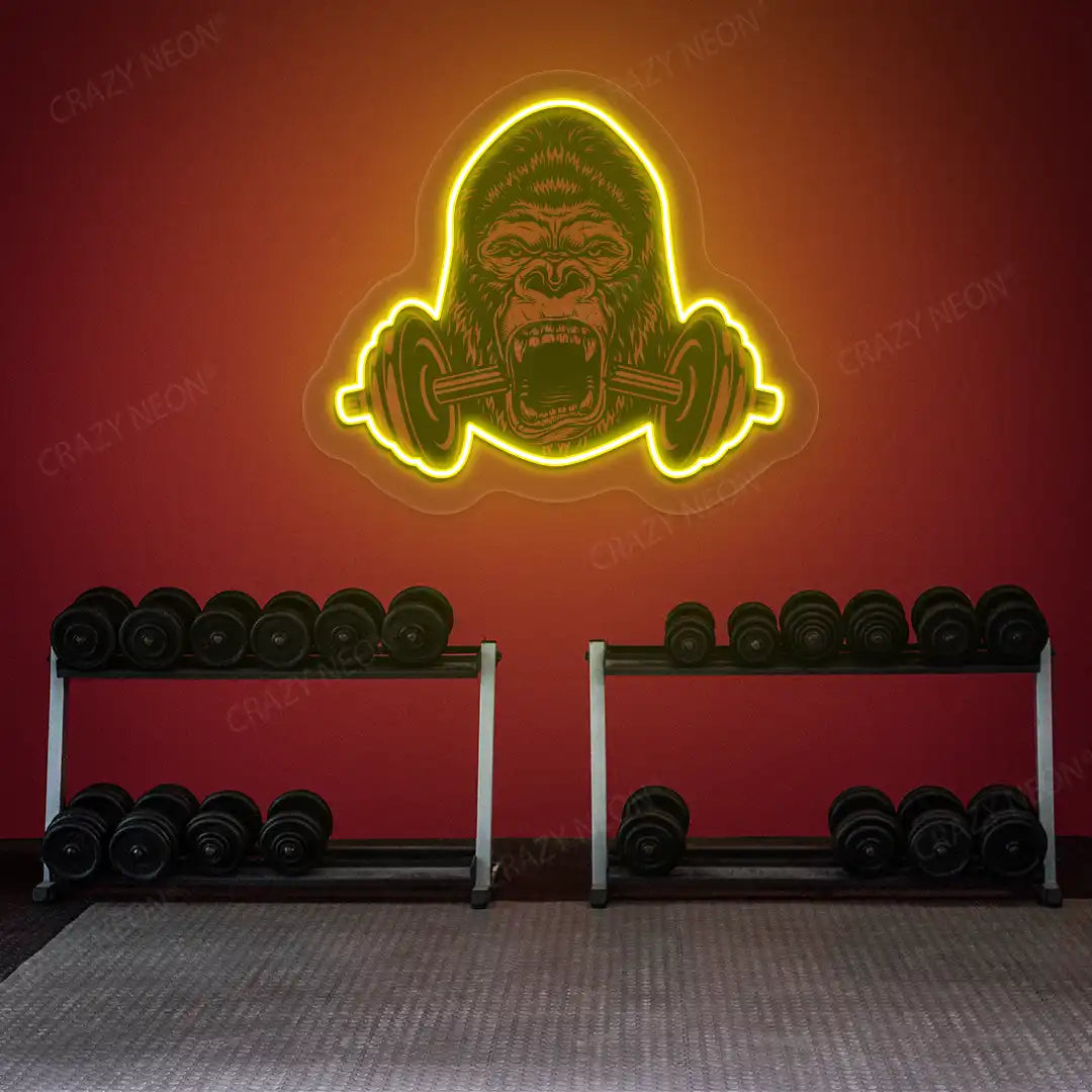 yellow gorilla barbell gym neon artwork mounted on a wall