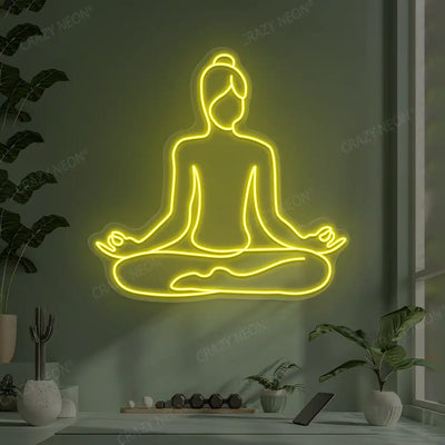Swastikasana Contour Yoga Neon Sign lighting up in yellow color in a yoga room