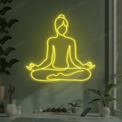 Swastikasana Contour Yoga Neon Sign lighting up in yellow color in a yoga room