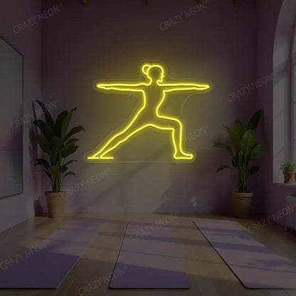 Virabhadrasana II Yoga Neon Sign lighting up in yellow color in a yoga room