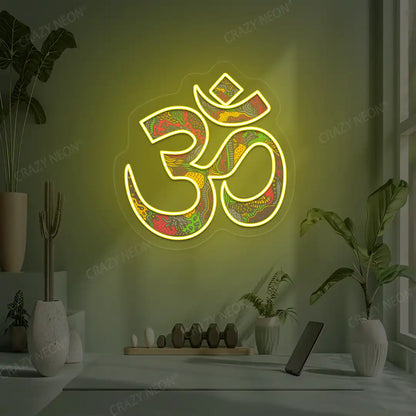 Psychedelic OM Neon Artwork lighting up in yellow color in a yoga room