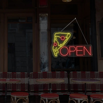 red pizza open neon sign hanging on a window