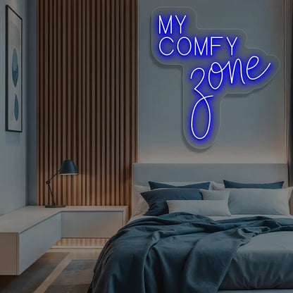 blue my comfy zone neon sign mounted on a wall