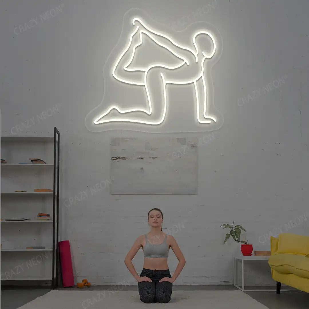 Eka Hasta Vyaghrasana Yoga Neon Sign glowing in warm white color in a yoga room
