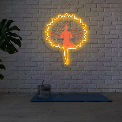 Mandala Yogi Harmony Tree Pose Yoga Neon Artwork lighting up in orange color in a yoga room