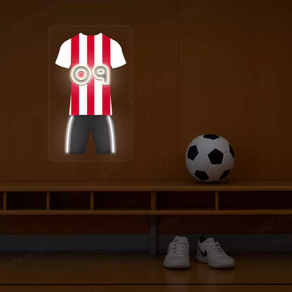 Red and white striped football jersey neon artwork with number 09 glowing on a wooden wall
