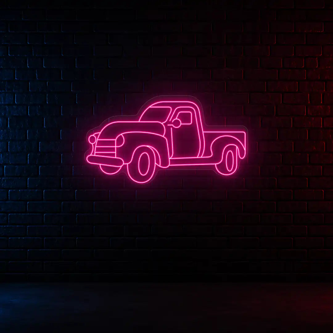 pink classic cruiser truck vintage neon sign mounted on a wall