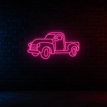 pink classic cruiser truck vintage neon sign mounted on a wall