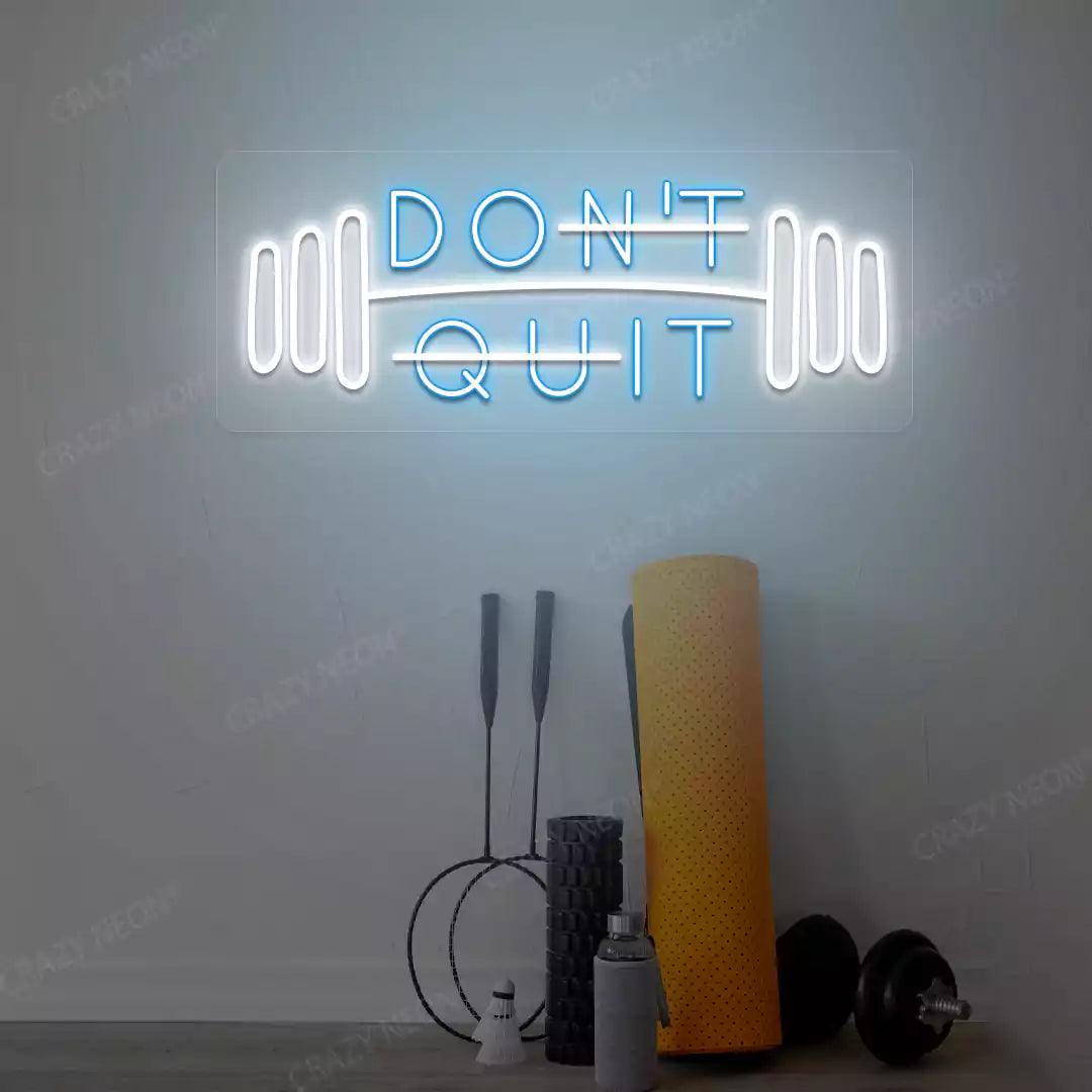 ice blue and white don’t quit do it neon sign mounted on a wall